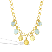 Load image into Gallery viewer, Dainty soft pastel cabochon cut Cat's Eye beryl, aquamarine and heliodor (39.7cts), adorn this 22k gold chain necklace, featuring individually hand shaped links woven together for a classic cable link chain. The chain fastens with our signature Shepherd's Hook clasp, decorated with a golden globe charm set with sparkling Cambodian blue zircons (.31ct). Length 16 inches.

Made with recycled 22k yellow gold and responsibly sourced gemstones.
