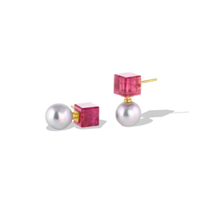 Load image into Gallery viewer, Deep pink tourmaline custom cut cubes provide a striking complement to the metallic blue tones of the Akoya pearls in these earrings. These unique stud earrings bridge the geometric modern and antiquity, with pearls being prized since ancient times. The buttery warmth of high karat yellow gold provides a rich patina. Length approximately 22mm W 10.5mm (L .8in W .4in).

Made in recycled 22k yellow gold, rubellite tourmaline (15.4ct) and 10.5mm Japanese blue Akoya pearls.

One-of-a-kind.