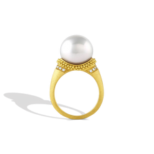 Load image into Gallery viewer, The folds and drape in the fabric and lace in Elizabethan ruffs were the inspiration behind this ring. Soft, brushed granulation, reminiscent of a velvet-like ruff highlighted with  a half ruff of diamonds, is draped around a glossy, luminous button shaped South Sea pearl. Made in recycled 22k gold and a cultured Paspaley south sea pearl. Size 7.

This ring can be made with different pearl and granulation options. Please contact concierge@atelierwolff.com for more information.