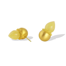 Load image into Gallery viewer, Golden spheres are edged with a ruff of gold granulation and set with polished yellow amber flame pointed drops. As the spheres are hollow, they are light and comfortable to wear. These uniquely shaped and versatile earrings can be worn as ear climbers or as a stud, simply turn the amber point downwards. Length approximately 19.9mm W 11.1mm (L .8in W .4in).

Made in recycled 22k yellow gold and hand carved Baltic yellow amber (4.48ctw).