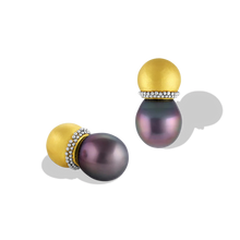Load image into Gallery viewer, Hollow golden spheres edged with a ruff of platinum granulation hold moody purple toned Tahitian pearls. These uniquely shaped and versatile earrings can be worn as ear climbers or as a stud, simply turn the pearls downwards. Length approximately 22.2mm W 11.9mm (L .8in W .5in).

Made in recycled 22k yellow gold and platinum and 11.9 x 13.6mm Tahitian pearls.

One-of-a-kind.