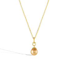 Load image into Gallery viewer, The Gold Pearl charm shown on a gold chain.