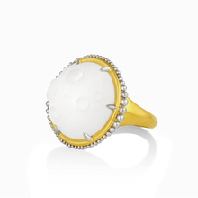 Load image into Gallery viewer, Moonstruck? We are! This hand carved rock crystal moon (16.95ct) complete with craters is overlaid on mother of pearl so that it shimmers as it moves. It was carved based on 3D terrain models of a part of the moon. Graduated polished platinum granules float orbit-like around the edges like tiny sparkling satellite moons. One-of-a-kind.

Made in recycled 22k yellow gold and platinum, hand carved rock crystal and mother of pearl. Size 7. Can be resized.