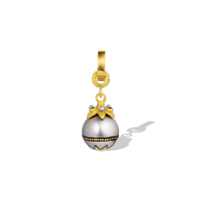 Load image into Gallery viewer, A delicate Maki-e pearl with a miniature bejeweled star cap. Rich, warm orange zircons complement the decorative 24 karat gold star painted on the lower half of the pearl, whilst the matte platinum granulation mirrors the soft silver tones in the pearl. A 20k gold clasp is included. L 27.5mm W 10 mm (L 1.1in W .4in).

Made from recycled 22k yellow gold, Nigerian zircons (.06ct) and a cultured 10.1mm Tahitian pearl. Please note that the chain is available separately.

One-of-a-kind.