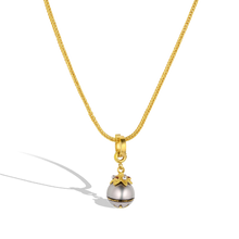 Load image into Gallery viewer, The Maki-e pearl charm with orange zircons on a handwoven chain.