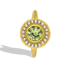 Load image into Gallery viewer, This unusual martini glass shaped ring features a light spring green tourmaline (1.19ct) with a beautiful metallic luster. The 'glass' is covered in gold granulation, giving volume and a soft feel to the fingertips. A sparkling 'salt' rim of oversize platinum granules highlights the metallic luster in the tourmaline. The ring band has a soft, parchment like feel. One-of-a-kind.

Made in recycled 22k yellow gold and platinum and a Moyo Gems tourmaline. Size 7.
