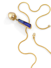 Load image into Gallery viewer, intensely colored, exclamation mark shaped boulder opal (5.38ct) sits atop a richly glowing golden triangular South Sea Pearl. The pearl's rich golden hue is accented by the granulated and curved oval cap, the tiny gold granules echoing the softly rounded pearl.
Made from recycled 22k gold, a Philippine South Sea Pearl (12.4x13.2mm) and an Australian boulder opal. Chain is available separately. Length approximately 53mm, width 10.89 (L 2in W .4in).