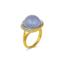 Load image into Gallery viewer, Mysterious lavender blue chalcedony (11.75ct) cut in a high round cabochon is set with delicate, barely-there platinum prongs and surrounded by sparkling platinum and gold granulation floating orbit-like around it. One-of-a-kind.

Made in recycled 22k yellow gold and platinum and Namibian chalcedony. Size 7.