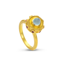 Load image into Gallery viewer, This dainty ring is reminiscent of a bejeweled Orb. Instead of a customary cross mounted top it, this one has a milky aquamarine (0.84ct) cut in a "bullet" style cabochon with a band of glittering hot pink spinels (.15ct) and golden balls of granulation surrounding it.

Made in recycled 22k yellow gold, responsibly sourced aquamarine (.84ctw) and spinel (.15ctw). Size 6.5. Can be resized. Made to order.