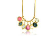Load image into Gallery viewer, Revival Charms on a handwoven gold chain. The Green Tourmaline Revival charm is second from the right.