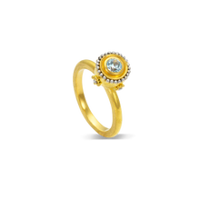 Load image into Gallery viewer, An icy blue zircon with a silvery platinum halo is given an almost medieval feel by the gold and platinum rosettes placed underneath the halo. This bejeweled orb can be worn alone or create your own story by mixing with other Orb rings or your favorite stacking bands.

Made in 22k yellow gold and platinum and a Cambodian zircon (.42ctw). Size 6.5.Can be resized. One-of-a-kind.