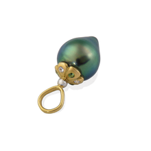 Load image into Gallery viewer, This iridescent silvery green teardrop pearl with shimmering blue overtones has a polished gold flower-shaped cap set with sparkling green tsavorite garnets and glittering diamonds on alternating petals. Length approximately 22mm, width 9.9mm (L .9in W .4in) Made from recycled 18k gold and platinum, a 9.95x11.8mm cultured Tahitian pearl, Canadian diamonds (.02ct VS G) and Kenyan tsavorite garnets (.05ct). The chain is available separately.