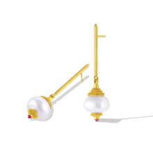 Load image into Gallery viewer, Golden pagoda style caps covered in tiny granulation perch atop circlé South Sea pearls. A curved cap sits below, with the same granulation flowing outwards from soft pink center set tourmalines. Long, elegant brushed golden sticks allow the pearls to swing gently from the ear, making these earrings unique and striking. Length approximately 46.5mm 12.8mm (L 1.8in W .5in). Made in recycled 22k yellow gold, 12mm Australian Paspaley South Sea pearls.