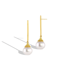 Load image into Gallery viewer, Golden pagoda style caps covered in tiny granulation balance atop button shaped Paspaley South Sea pearls. Long, elegant brushed golden sticks allow the pearls to swing gently from the ear, making these earrings unique and striking. Though the pearls are generous in size, these earrings have a "barely there" feeling to them. Length approximately 48mm W 13.7mm (L 1.8in W .54in).

Made in recycled 22k yellow gold and 13mm Australian Paspaley South Sea pearls.

One-of-a-kind.