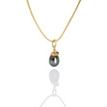 Load image into Gallery viewer, A very special eggplant shaped gray pearl with peacock tones and wonderful luster. A spiral granulated cap takes the eye up and around the pearl to find the sparkling grass green tsavorite garnet floating atop the spiral. Length approx. 27mm, width 10.5mm (L 1.1in W .4in).
 Made from recycled 18k gold &amp; 22k gold, a 13.1x10.5mm cultured Tahitian pearl and tsavorite garnet (.13ctw) from the Scorpion mine in Taita, Kenya. The chain is available separately.