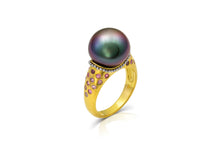 Load image into Gallery viewer, One-of-a-kind ring with granulation draped around a moody iridescent purple toned Tahitian pearl. Lavender and purple toned Malawi sapphires and purplish red Anthill garnets, totaling .54ct, complement the pearl's purple tones.

Made in 22k yellow gold and platinum. Size 7.

This ring can be made with different pearl and gemstone options, please contact concierge@atelierwolff.com to start a conversation.