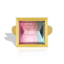 Load image into Gallery viewer, One of our custom cut bi-color tourmalines, this beautiful rectangular lozenge shape gem is a vibrant pink and blue with a glittering, reflective surface. This particular cut gives a mirror like polish to the gem (hence the name "mirror cut"), whereby you can see the intricate open latticework on the high bezel setting is reflected in it. 

Made from recycled gold and a tourmaline (10.29ctw) from Itambacurí, Brazil. Size 7. Can be resized. One-of-a-kind.