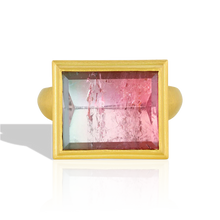 Load image into Gallery viewer, This beautiful rectangular lozenge shape tourmaline (9.42ct) is an unusual metallic salmon pink and teal with a glittering, reflective surface. Mirror cutting a gem does exactly that - gives a mirror like polish to the gem (hence the name), reflecting the intricate open latticework on the high bezel setting. 

Made from recycled 22k gold and a bi-color tourmaline from Itambacurí, Brazil. Size 7. Can be resized. One-of-a-kind.