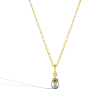 Load image into Gallery viewer, The charm shown on a gold chain.