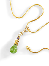 Load image into Gallery viewer, The peridot Perfumer's Flask charm on a chain.