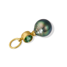 Load image into Gallery viewer, Yes, The Green Charm. A lustrous, vivid, deep green circlé pearl paired with a gorgeous vivid blueish green tourmaline make this a mighty charm. The color and luster of both the pearl and gem are simply stunning! Wear with your favorite chain by itself or mix it up with your favorite charms and chains. Length approx. 27.6mm, width 10.3mm (L 1.1in W .4in). Made from recycled 22k gold, a 10.4x12.5mm cultured Tahitian pearl and Brazilian tourmaline (.71ctw). The chain is available separately.