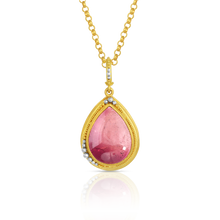 Load image into Gallery viewer, The apricot and blush pink Tourmaline Revival charm shown on a gold rolo style chain.