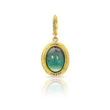 Load image into Gallery viewer, Inspired by both the original Etruscan and Castellani jewels, this oval bicolor blue green and pink tourmaline is edged with our signature graduated gold and platinum granulation. A similarly granulated bail completes the charm.

Handmade using recycled 22k yellow gold and platinum and a bi-color Brazilian tourmaline (5.98ctw). Length approximately 32 mm, width 14mm (L 1.25in W .55in).

One-of-a-kind.