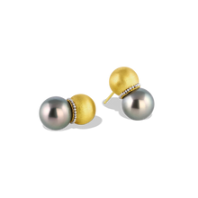 Load image into Gallery viewer, Hollow golden spheres edged with a delicate ruff of platinum granulation are set with lustrous round blue Tahitian pearls. These uniquely shaped and versatile earrings can be worn as ear climbers or as a drop, for climbers simply turn the pearls downwards. A pearl collector's choice for everyday wear. Length approximately 21mm W 12mm (L .8mm W .45in).

Made with recycled 22k yellow gold, platinum and cultured 12mm Tahitian pearls.