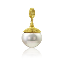 Load image into Gallery viewer, Another of the baroque and circlé South Sea pearls we acquired from Australia. Pearls are one of my favorite "gemstones", and I love saltwater pearls in all their colors and shapes. This is an especially beautiful circlé style, with a sensuous shape. Our signature velvet granulation surrounds a rounded conical cap in a flared pattern reminiscent of a Fibonacci spiral. Length approximately 32mm W 16 (L 1.26 x W .6 in).

Made from recycled 22k gold and a 16mm Paspaley South Sea pearl.

One-of-a-kind.