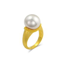 Load image into Gallery viewer, The folds and drape in the fabric and lace in Elizabethan ruffs were the inspiration behind this ring. Soft, brushed granulation, reminiscent of a velvet-like ruff is draped around a glossy, luminous button shaped South Sea pearl. Made in recycled 22k gold and a cultured Paspaley south sea pearl. Size 7.

This ring can be made with different pearl and granulation options. Please contact concierge@atelierwolff.com for more information.