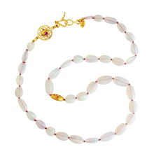 Load image into Gallery viewer, Famed for their translucency and play of color, these Welo opal beads show flashes red, orange, yellow, pink, green and blue. A single brushed gold bead sprinkled with sapphires, rubies and spi foil for the opals. An intricate Byzantine style filigree decorative rondelle, gem set on each side, completes the necklace. Length 19 inches. Made from recycled 22k gold, natural Welo opal (67.25ctw), emerald (.06ctw), pink spinel (.14ctw), sapphires (.02ctw), ruby (.04ctw). Knotted on silk. One-of-a-kind.