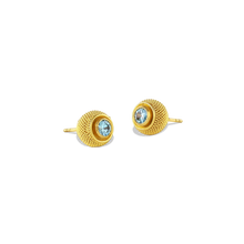 Load image into Gallery viewer, Elegant yet versatile, these cushion style stud earrings feature delicate all over granulation with a pop of color, courtesy of vivid blue zircons. Although ancient in technique, the granulation gives quite the modern look. The warm buttery tone of the gold and granulated texture give the appearance of the pile on a velvet cushion and feels soft to the touch. Diameter approximately 9mm, length 18mm (D .36in L .7in)

Made in recycled 22k yellow gold and Cambodian blue zircon (.5ctw).